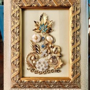Framed vintage jewelry art.